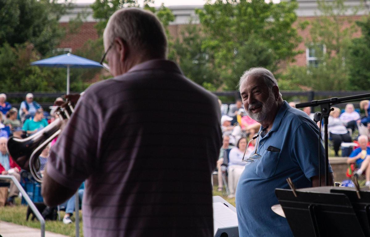 Vince DiMartino of the The DiMartino-Osland Jazz Orchestra looks over at his fellow players during their show at the weekly Big Band and Jazz performance at the MoonDance Amphitheater in Lexington, Ky., on June 1, 2021.