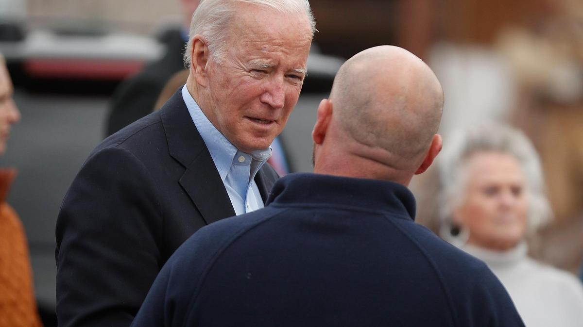 President Joe Biden meets with people as he tours the region surveying tornado damage in downtown Mayfield, Ky., Wednesday, Dec. 15, 2021.