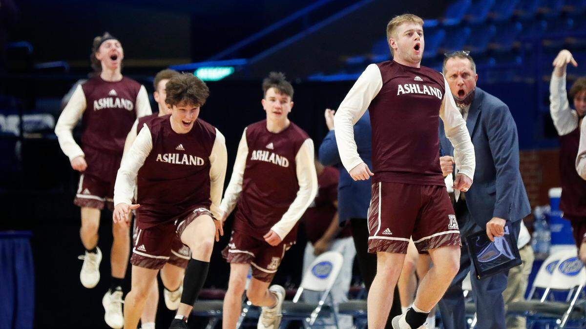 Members of the Ashland Blazer basketball team celebrate during the Tomcats’ 80-44 victory over Boyle County on Friday.
