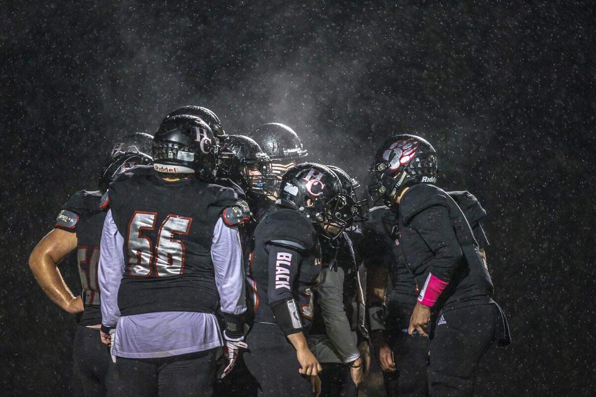 The Black Bears huddle before a play at Coal Miners’ Memorial Stadium during a game against Perry County on Friday, October 25. The Black Bears won, 49-19.