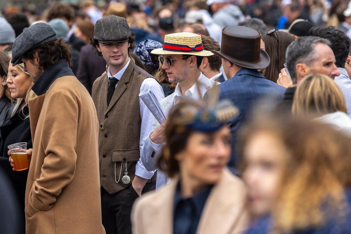 Spectators wait for the start of a race on opening day at Keeneland on Friday.