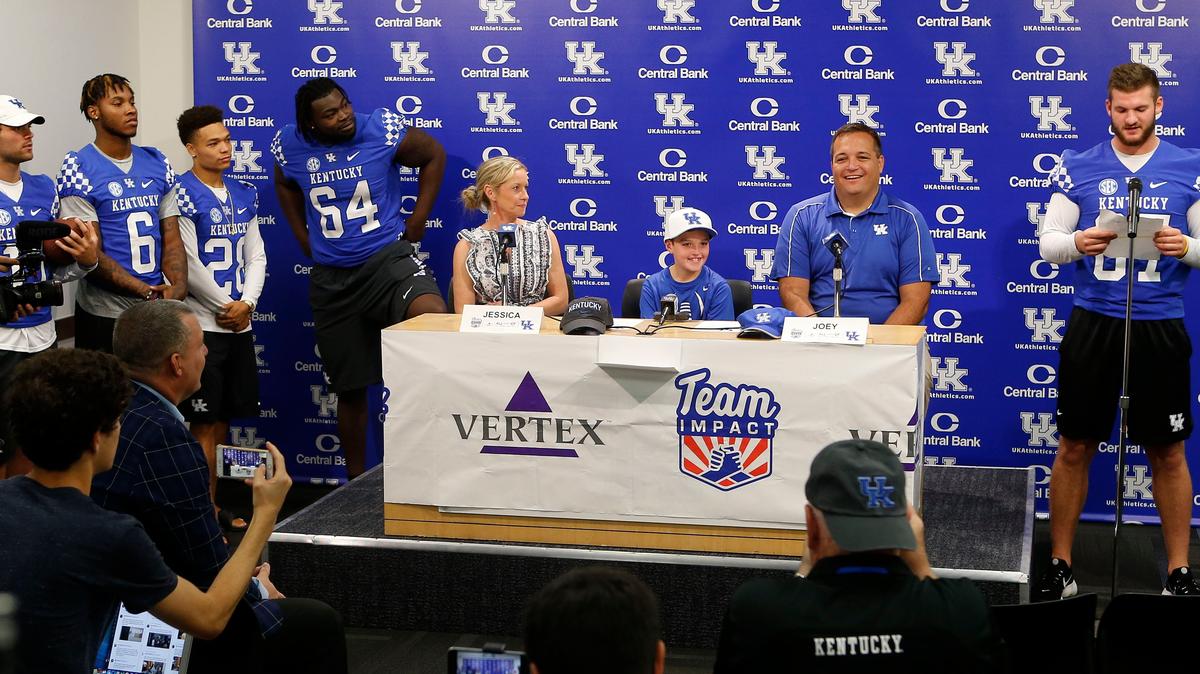 Luke Klausing, an 11-year-old boy from Louisville with cystic fibrosis, had  a “signing day” event Wednesday morning to join UK’s football team for the season as part of a community outreach project for UK football. Klausing will be a regular on the UK sidelines this season as he battles his disease. Beside Luke were his parents, Jessica and Joey Klausing. Players Walker Wood, Lonnie Johnson Jr., Zach Johnson, George Asafo-Adjei and C.J. Conrad were on hand as Team Impact captains.