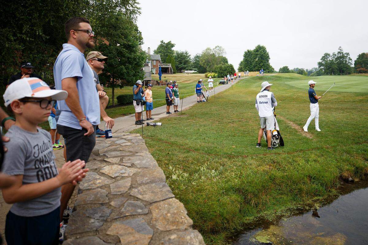 Adam Svensson, right, plays his third shot on No. 5 during the second round of the PGA Barbasol Championship on Friday, July 8, 2022, at Keene Trace Golf Club in Nicholasville, Kentucky.