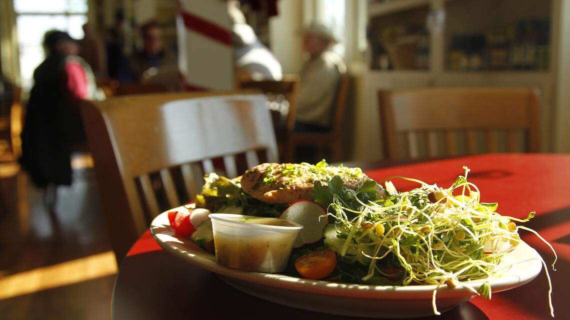 Greens for the salmon salad and other menu items at Windy Corner Market are grown at a nearby farm.