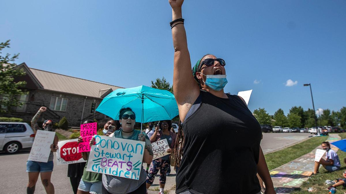 Sarah Williams protests outside the Fraternal Order of Police Bluegrass Lodge 4 in Lexington, Ky., before Former Lexington police chaplain Donovan Stewart speaks on Thursday, July 9, 2020. Stewart has retired from the police department and filed a defamation lawsuit against Sarah Williams and April Taylor and 10 other unnamed ÒJohn Does.Ó