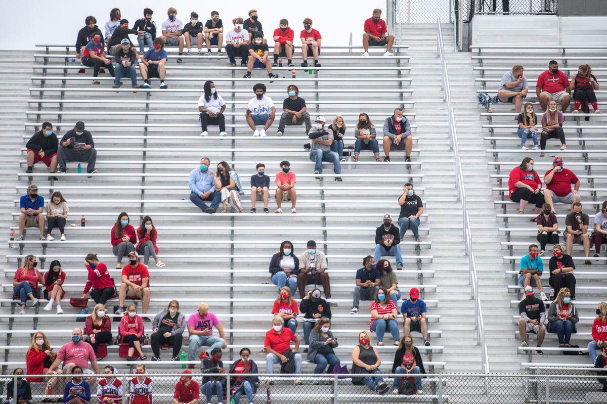 Spectators wore masks and sat socially distanced during Scott County’s game against Bryan Station at Great Crossing High School on Friday night. Scott County beat Bryan Station, 7-6.
