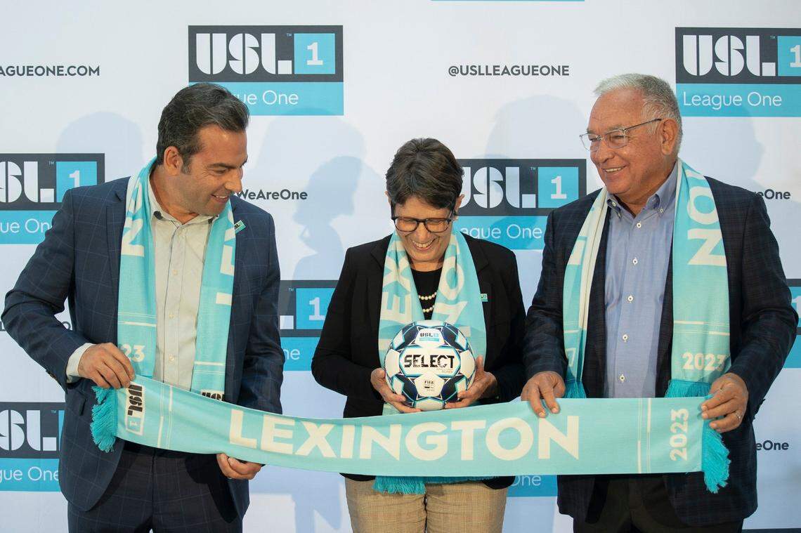 Lexington Mayor Linda Gorton posed for photos with Stephen Dawahare, left, and William J. Shively, right, during last fall’s announcement that Lexington has been awarded a pro soccer franchise in USL League One. Shively is the franchise’s majority owner; Dawahare is a minority owner. The team begins play in the spring of 2023.