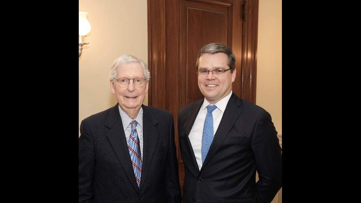 Sen. Mitch McConnell, left, pictured with newly confirmed U.S. District Court for the Eastern District of Kentucky Judge Chad Meredith, right. The U.S. Senate voted 48-45 Thursday to appoint him to the bench.