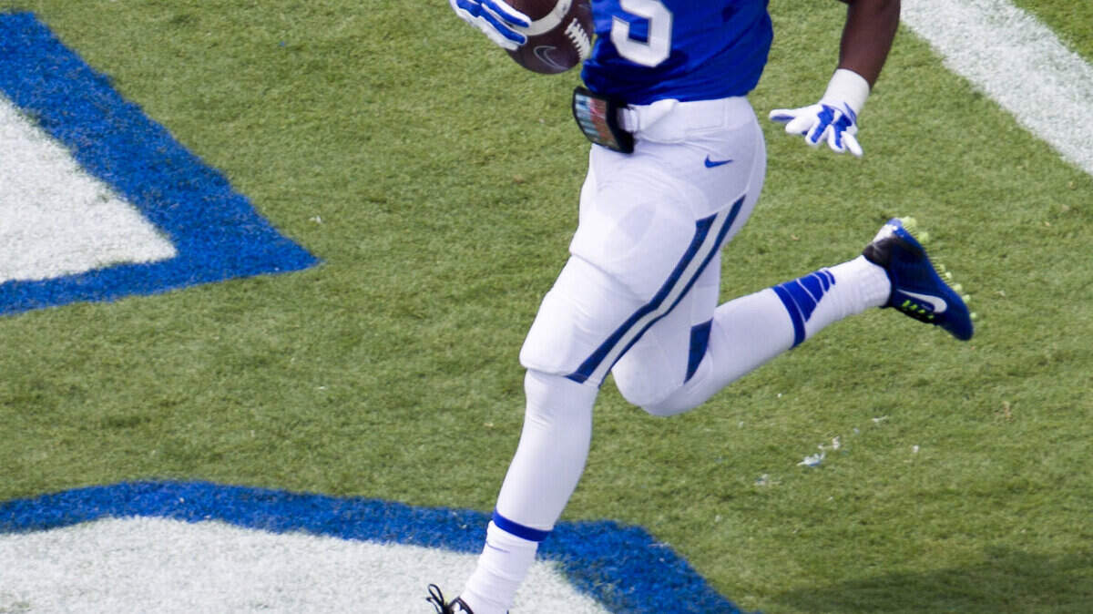Kentucky Wildcats running back Braylon Heard (5) ran for a touchdown as Kentucky beats UT Martin 59-14 in Commonwealth Stadium on August 30, 2014.  Photo by Mark Mahan