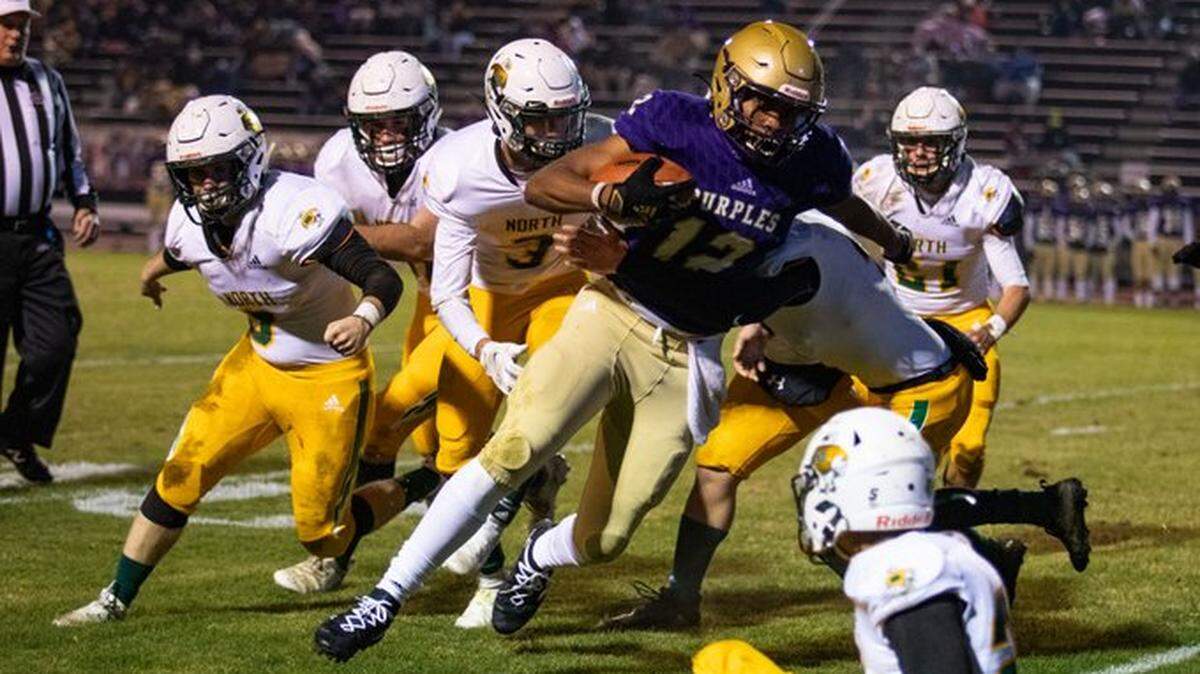 Bowling Green tight end Jordan Dingle attempts to run the ball into the end zone for a two-point conversion during the Purples’ 55-7 win against North Bullitt on Friday in a Class 5A state quarterfinal game at El Donaldson Stadium. Dingle was named first team all-state by the Associated Press.