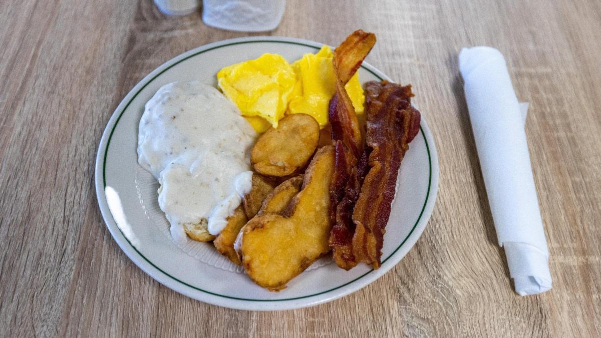 The breakfast special at the Keeneland Track Kitchen with bacon, eggs, biscuits, gravy, and potatoes.
