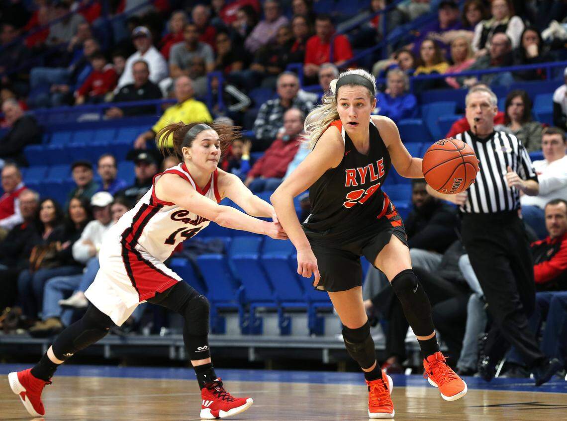 Ryle’s Maddie Scherr moved the ball under pressure from Clark County’s Kennedy Igo in March 2019 the quarterfinals of the KHSAA Girls’ Sweet Sixteen at Rupp Arena. Scherr helped lead Ryle to the 2019 state title.