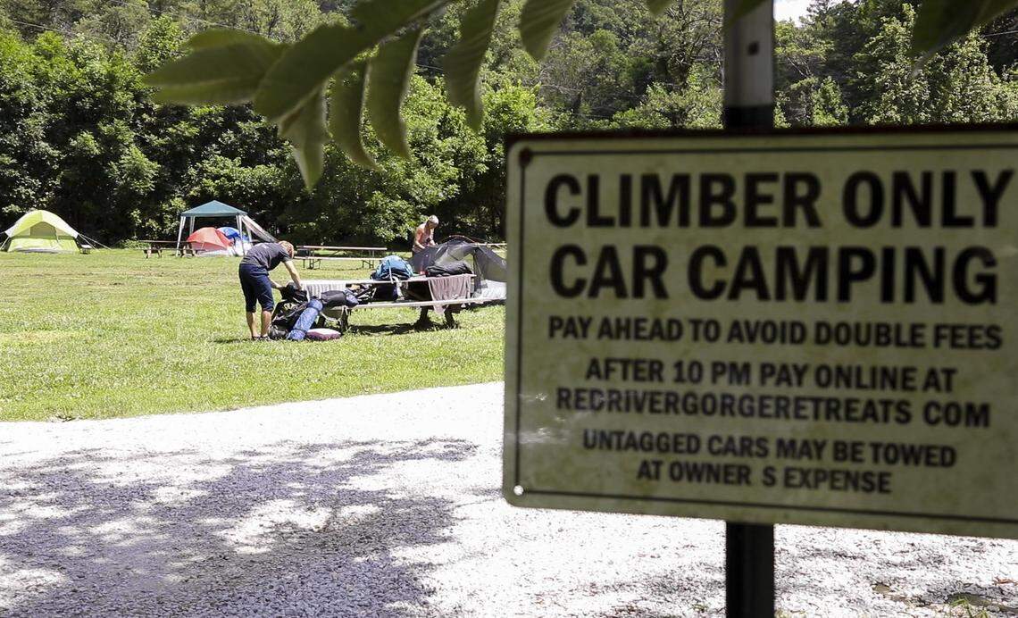 Climbers camping behind Miguel’s Pizza pack up their gear from their camp site July 14 in Red River Gorge. Miguel’s pizza originally allowed some of the first climbers to the gorge to camp behind their shop and has continued to allow only climbers to stay behind the shop to keep with tradition.