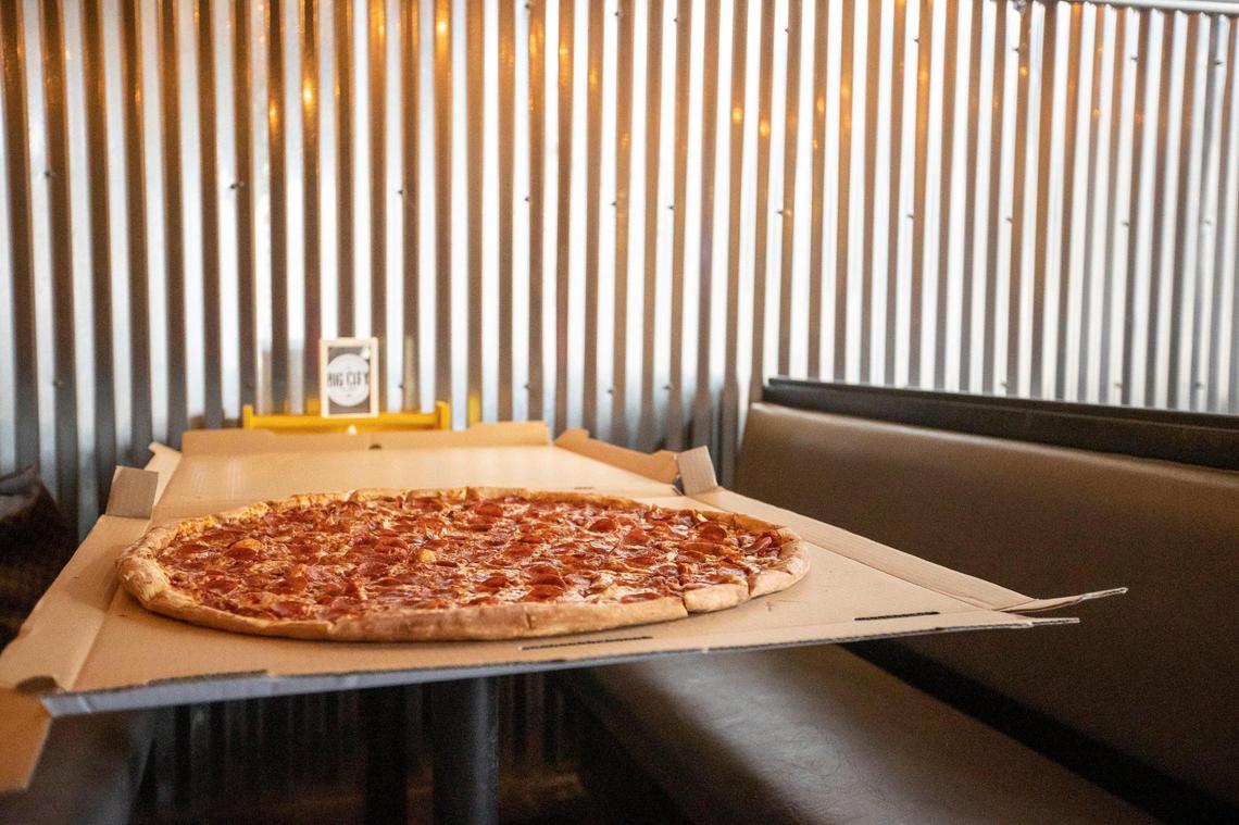 A Big Bambino takes up a full table at Lexington's Big City Pizza. Cut into 3-inch squares, it feeds 10.
