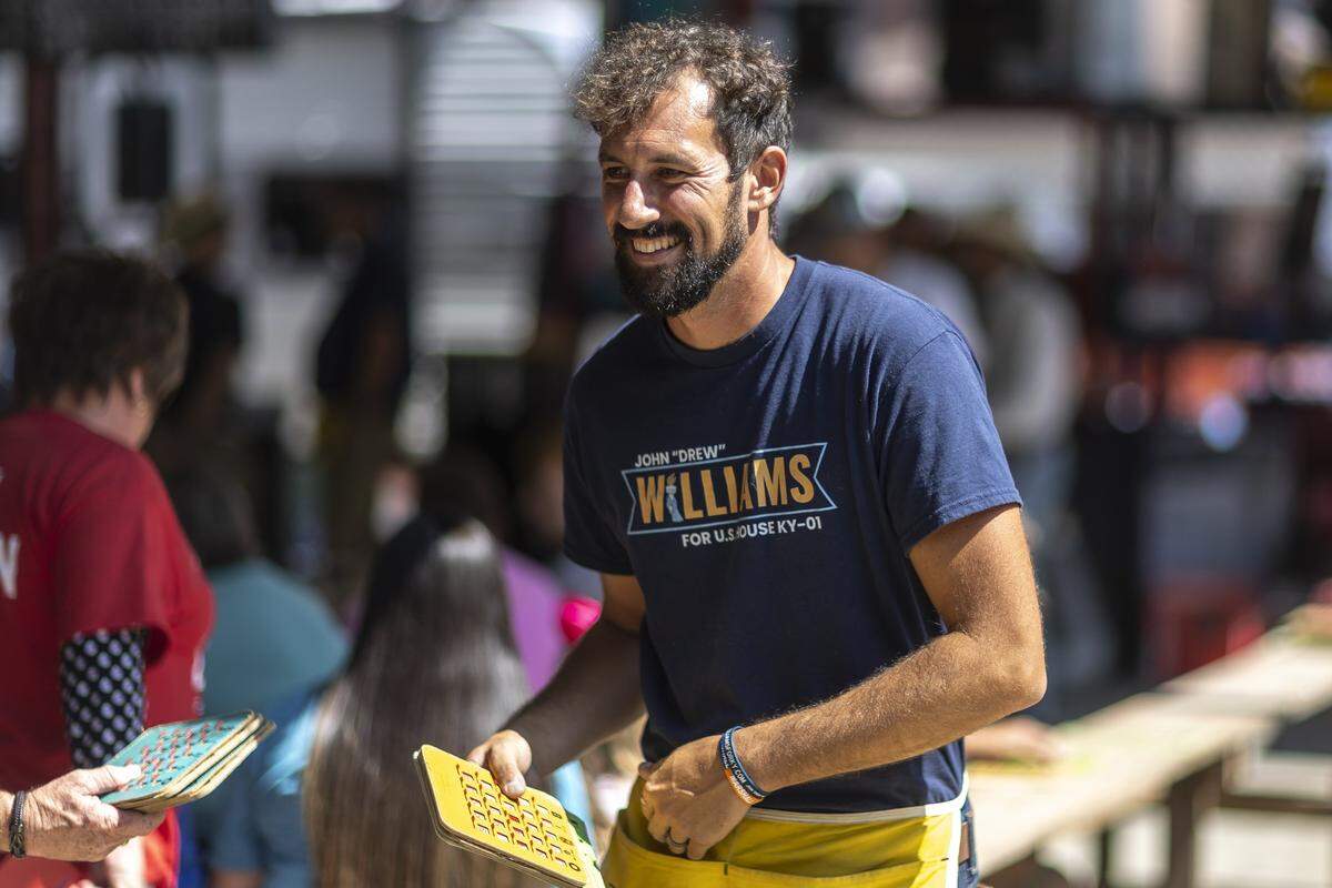 John “Drew” Williams, a candidate for the U.S. House of Representatives, hands out bingo cards during the 145th annual Fancy Farm Picnic at St. Jerome Catholic Church in Fancy Farm, Ky., on Saturday, Aug. 2, 2025.