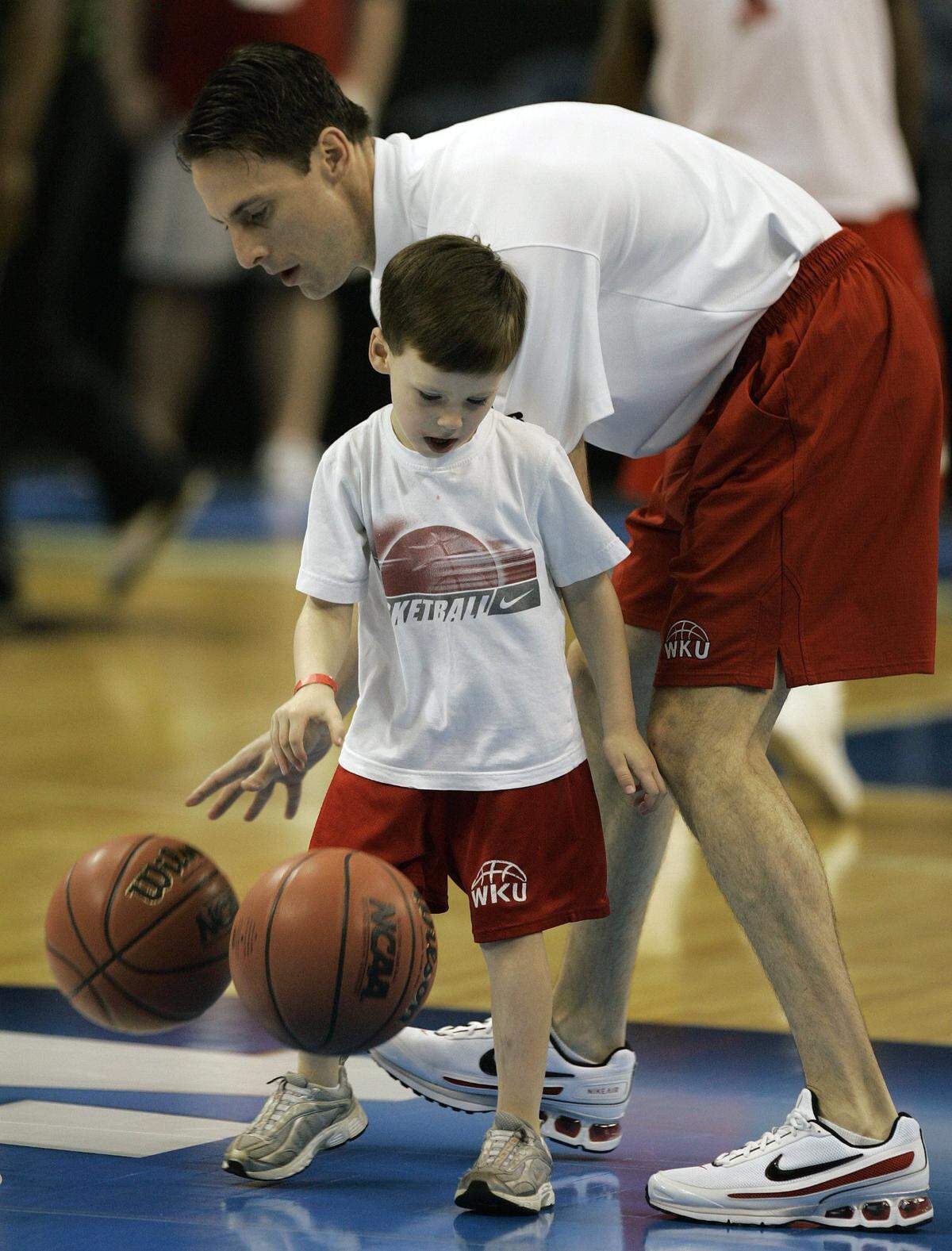 Then-Western Kentucky coach Darrin Horn dribbled basketballs with his then-4-year-old son, Walker, during an NCAA West Regional basketball practice held the day before No. 12 seed WKU upset No. 5 seed Drake on Ty Rogers’ famous buzzer beater in the 2008 NCAA Tournament round of 64.