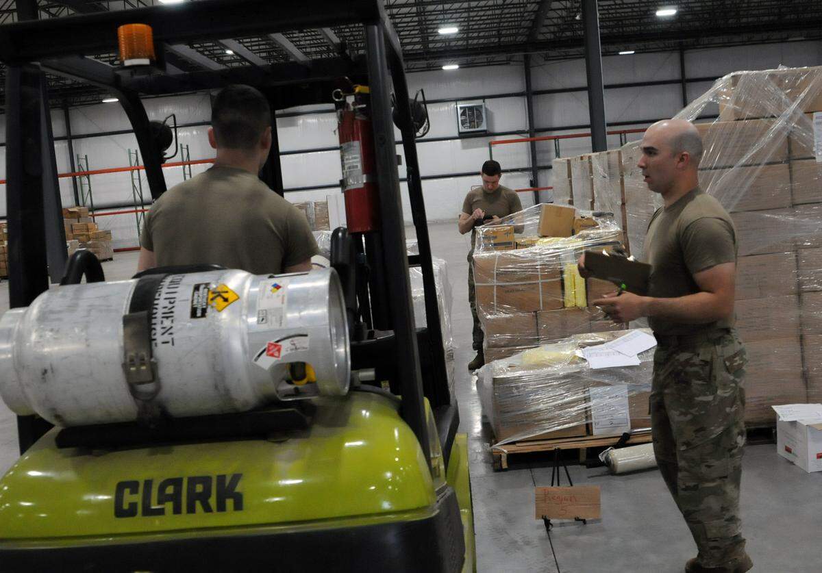 Members of the Kentucky National Guard handle stockpiles of medical supplies for Kentucky’s fight against COVID-19.