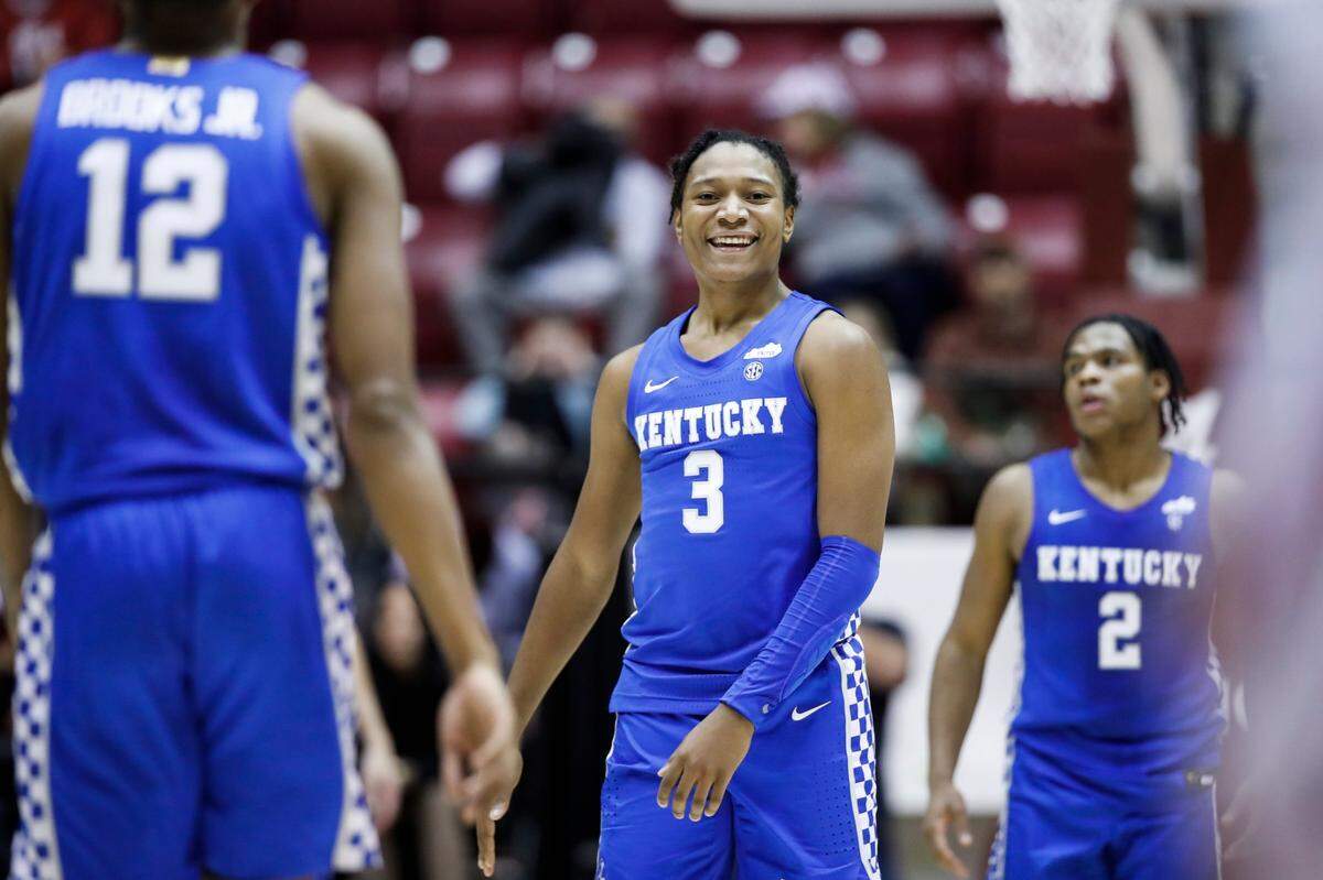 Kentucky’s TyTy Washington (3) smiles during the closing seconds of the Wildcats’ 66-55 win Saturday night. Washington led five UK players in double figures with 15 points.