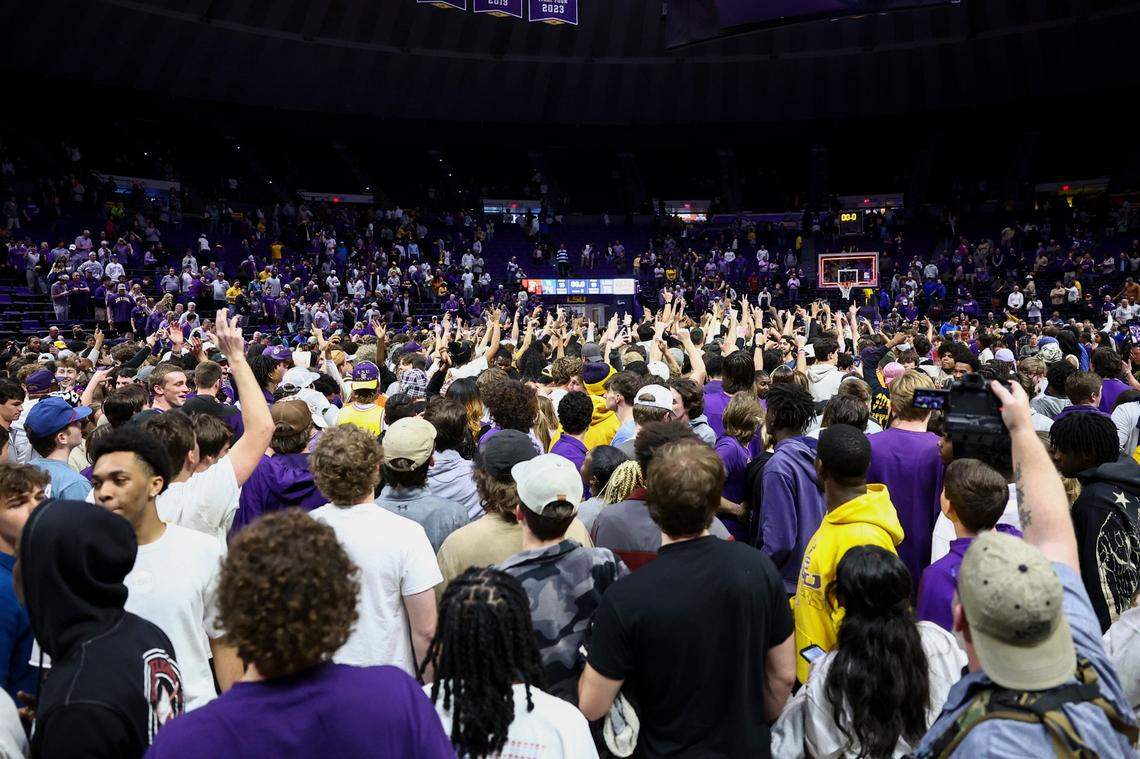 Students and fans rush the court after LSU defeated Kentucky 75-74 at the Pete Maravich Assembly Center in Baton Rouge, Louisiana.