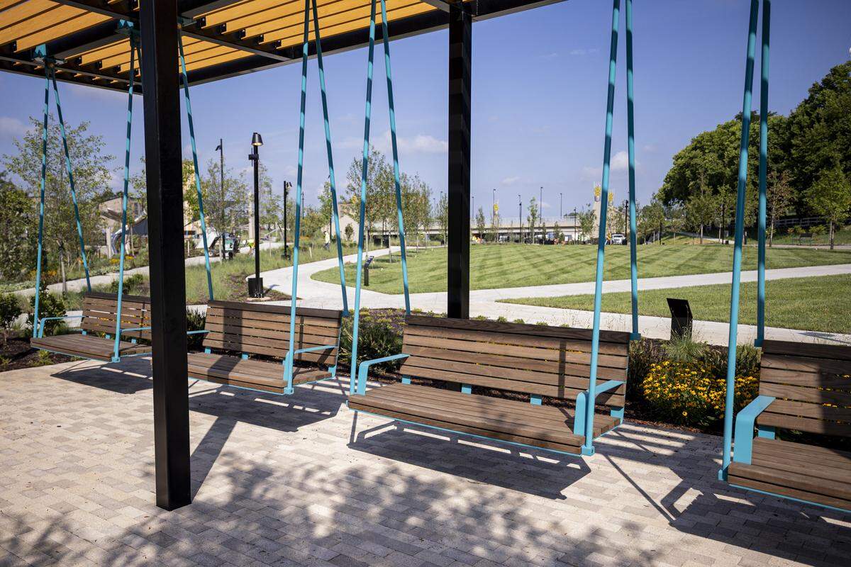 Shaded swings behind the stage during a tour on Thursday, Aug. 14, 2025, at Gatton Park on the Town Branch in Lexington, Ky. 
