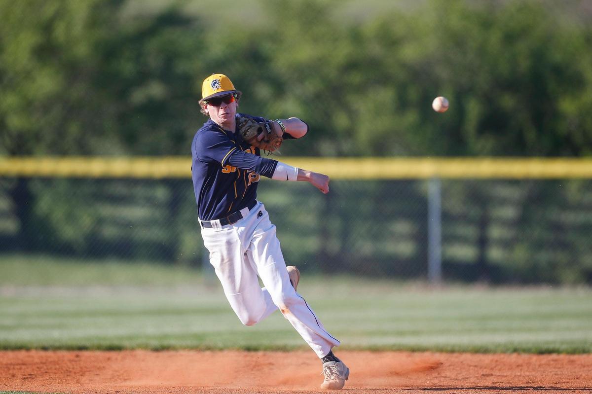 Sayre’s Grady Johnson (25) throws out a Frederick Douglass runner at first base during Tuesday’s game at Sayre. The teams split back-to-back games Tuesday and Wednesday.