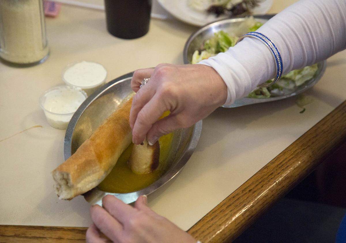 Joe Bologna’s breadstick comes in a tray of garlic butter.