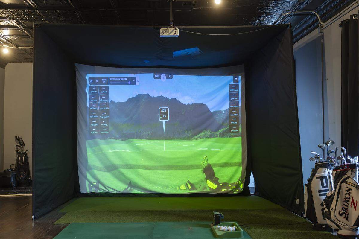The golf simulator at Birdies & Barrels offers access to more than 3,200 courses –  including local courses like Keene Trace, Woodson Bend and General Burnside Island.