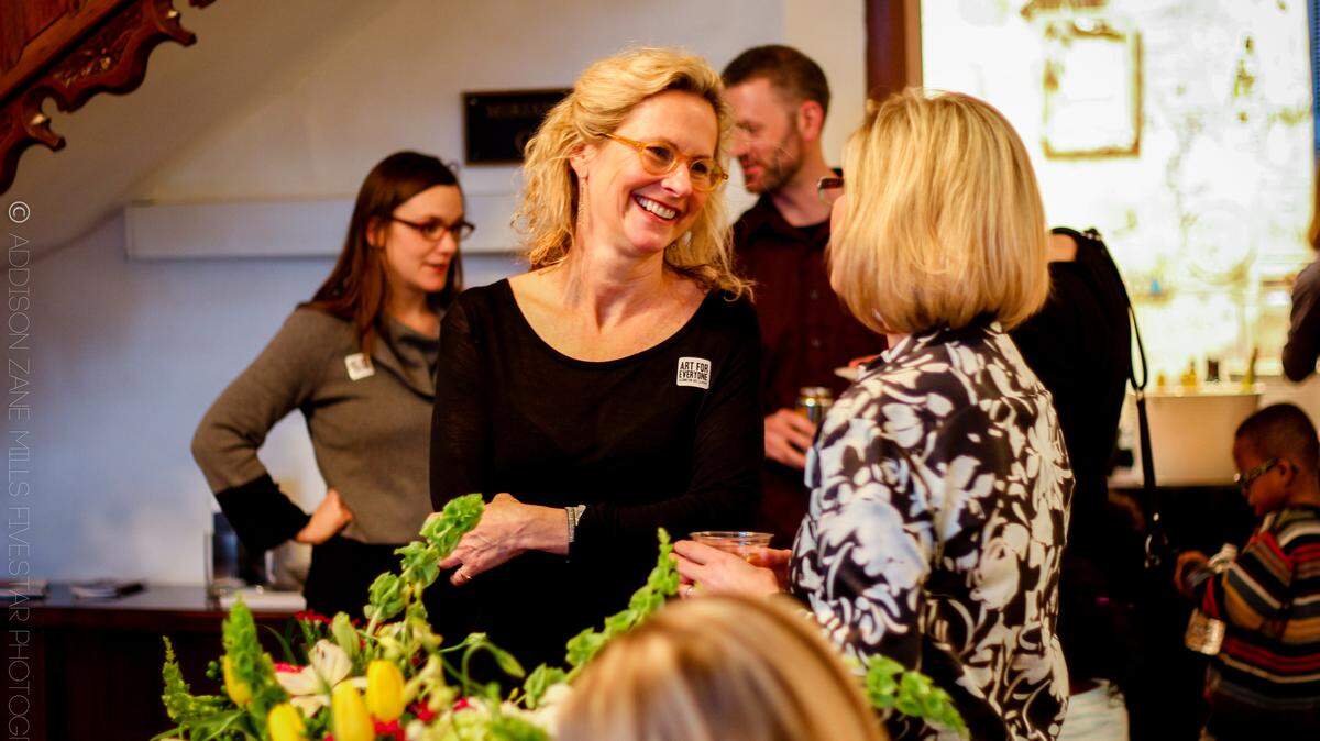 Artist and teacher Georgia Henkel greeted visitors at the opening reception for Currents: Horror Amour, an exhibit that she curated at the Loudoun House.