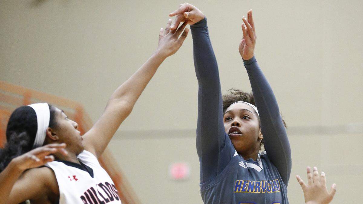 Henry Clay’s Kiya Thompson (right) averages a team-best 17.4 points per game for the Blue Devils.