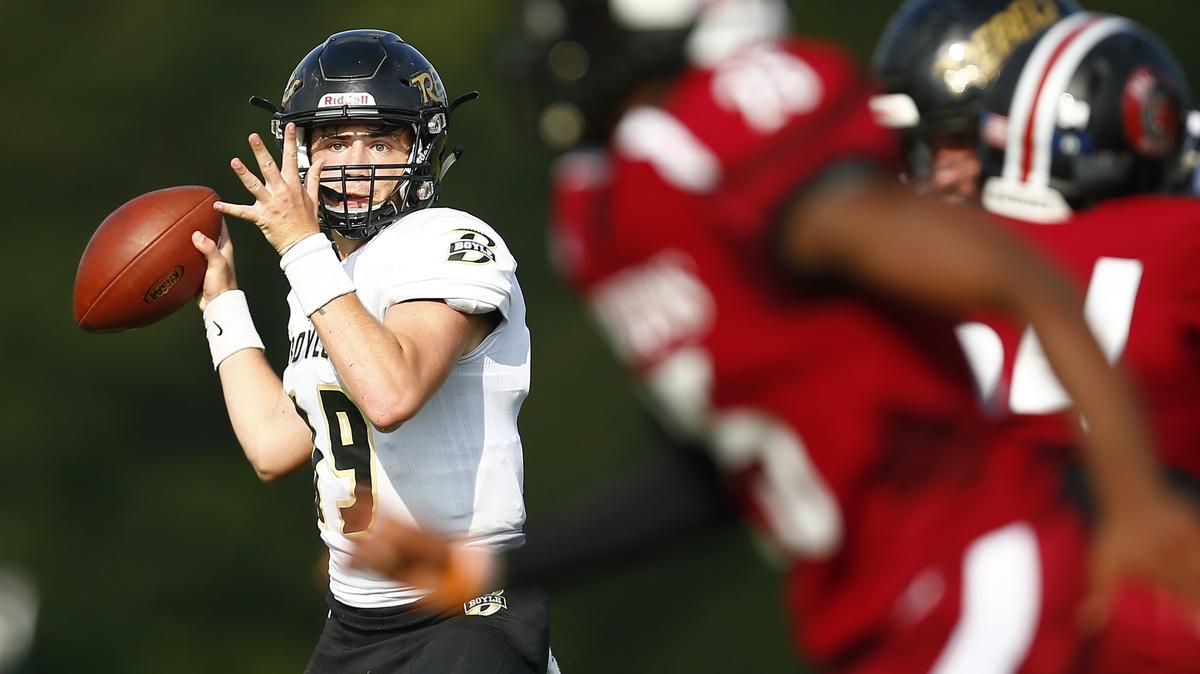 Boyle County’s Reed Lanter (19) passed the ball over Ballard defenders during the Little Caesars Ft. Harrod Bowl Saturday at Alvis Johnson Field in Harrodsburg. Boyle County beat Ballard 35-21.