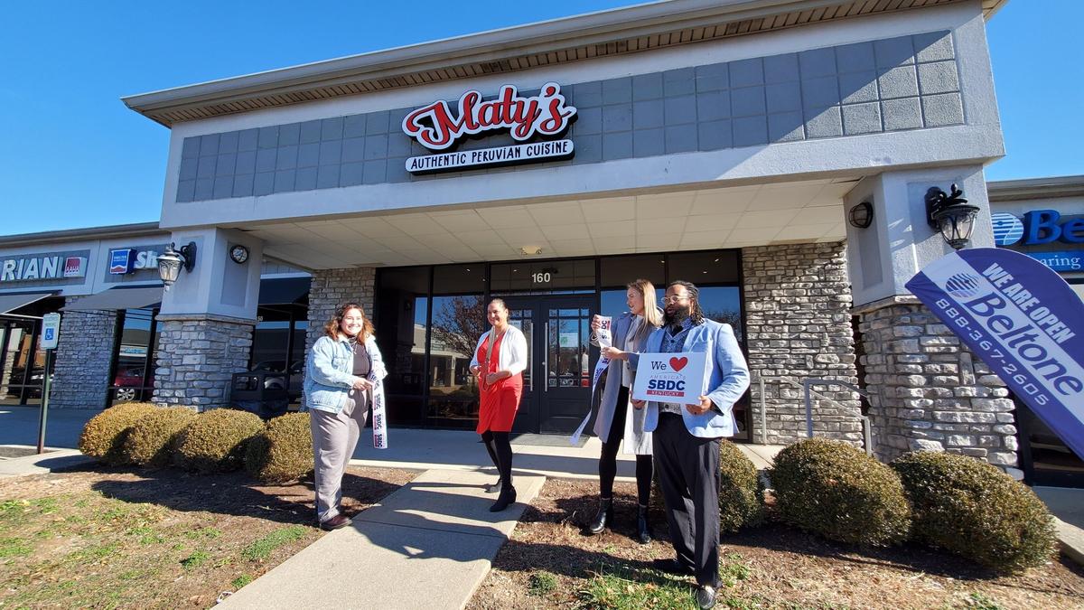 Maria Rivera, center, celebrated the opening of her restaurant Maty’s Peruvian Cuisine on Old Harrodsburg Road with a ribbon cutting ceremony on November 29, 2021.