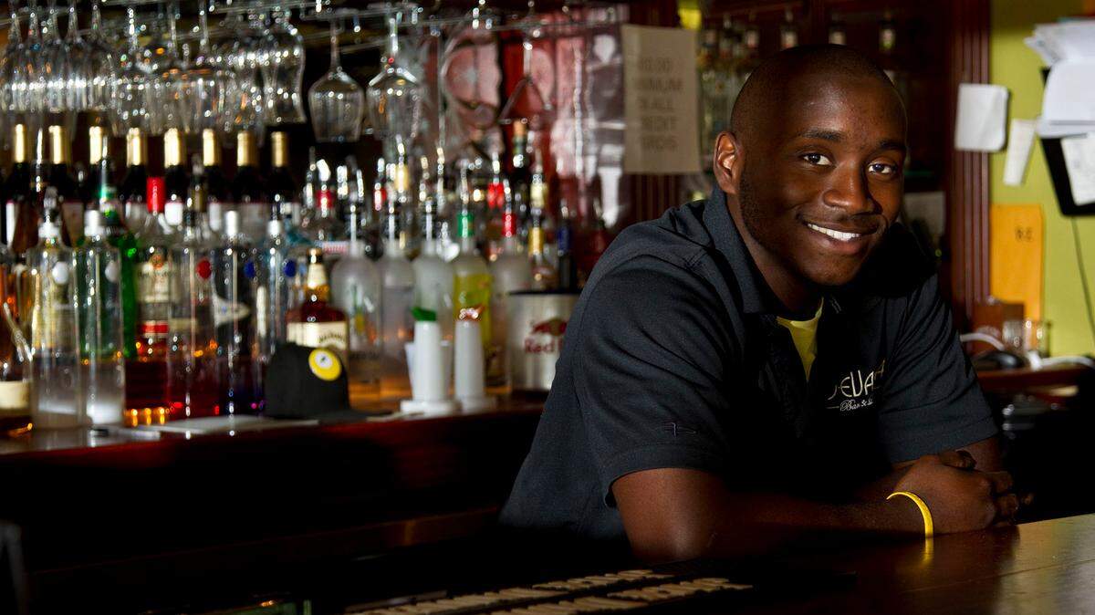 Devassa Bar and Lounge bartender Aaron Holmes Jr., a student at  Eastern Kentucky University, also is a professional music producer. 