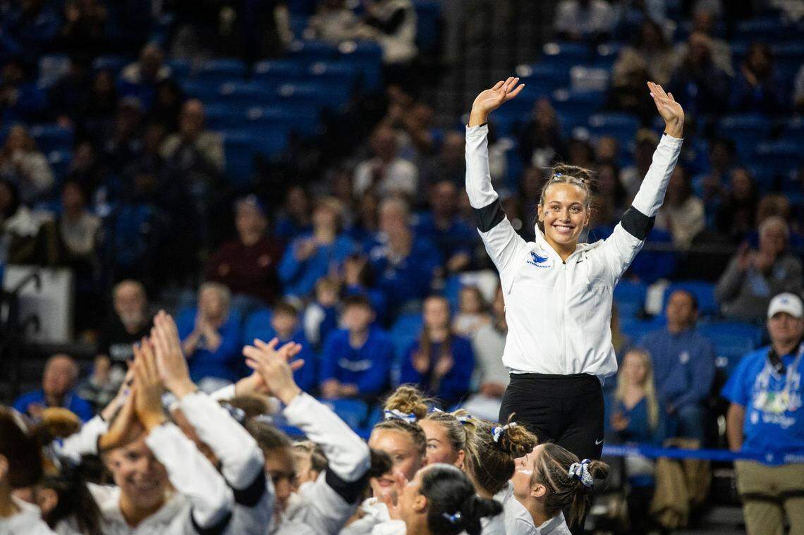 Delaynee Rodriguez celebrates Kentucky’s victory over Alabama, which included her tying for the all-around win Friday night.