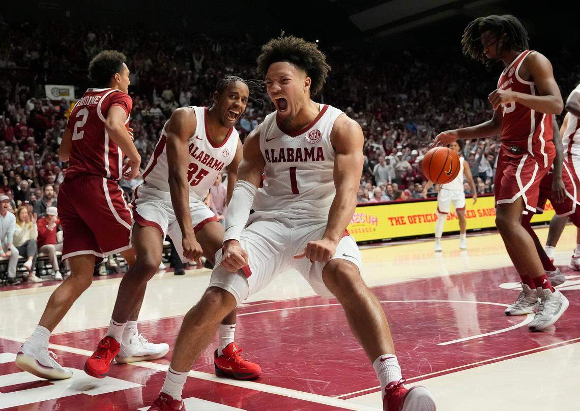 Jan 4, 2025; Tuscaloosa, AL, USA; Alabama forward Derrion Reid (35) and Alabama guard Mark Sears (1) react after Reid dunked on an alley oop pass from Sears at Coleman Coliseum. Alabama defeated Oklahoma 107-79. Mandatory Credit: Gary Cosby Jr.-Tuscaloosa News