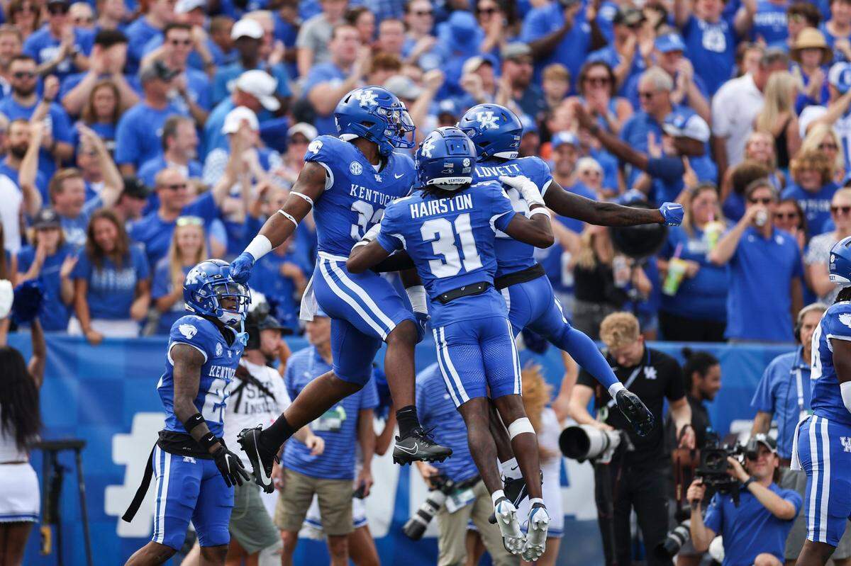 Kentucky linebacker Trevin Wallace (32) celebrates an interception against Florida during Saturday’s game at Kroger Field.