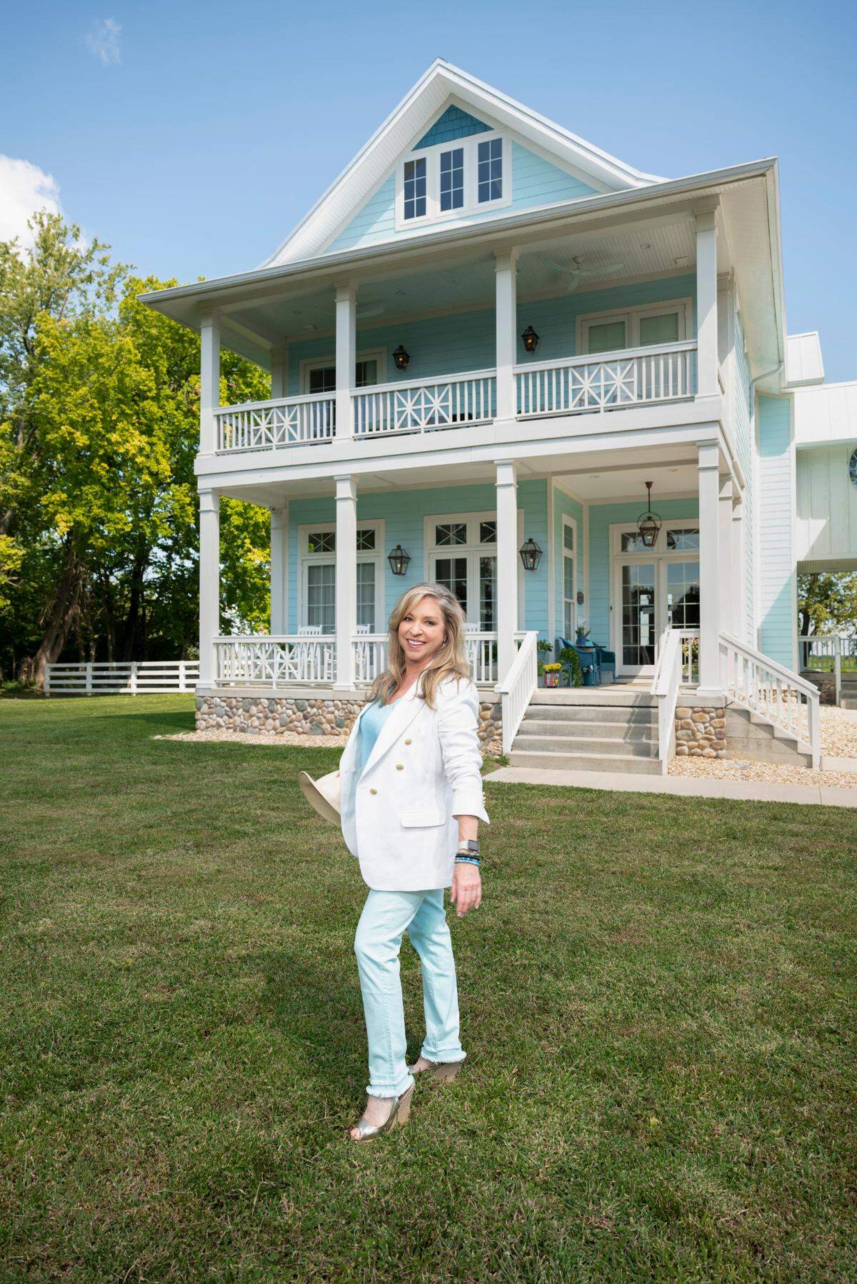 Picture of Jane Hale in front of the Bleuvbird Studio + Suites in Georgetown