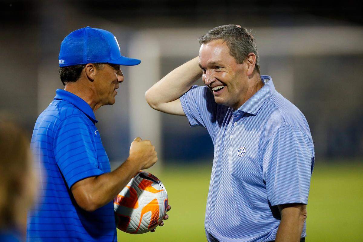 University of Kentucky Athletics Director Mitch Barnhart talks with women’s soccer head coach Troy Fabiano at a match last season, Fabiano’s first with the Wildcats. UK women’s soccer hosts Eastern Kentucky University on Thursday night in the first UK regular season athletics contest of the 2023-24 school year.