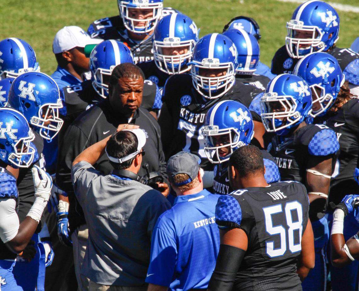 Vince Marrow (center, facing camera) has filled vital roles for Mark Stoops’ coaching staff both on the field and off through the years.