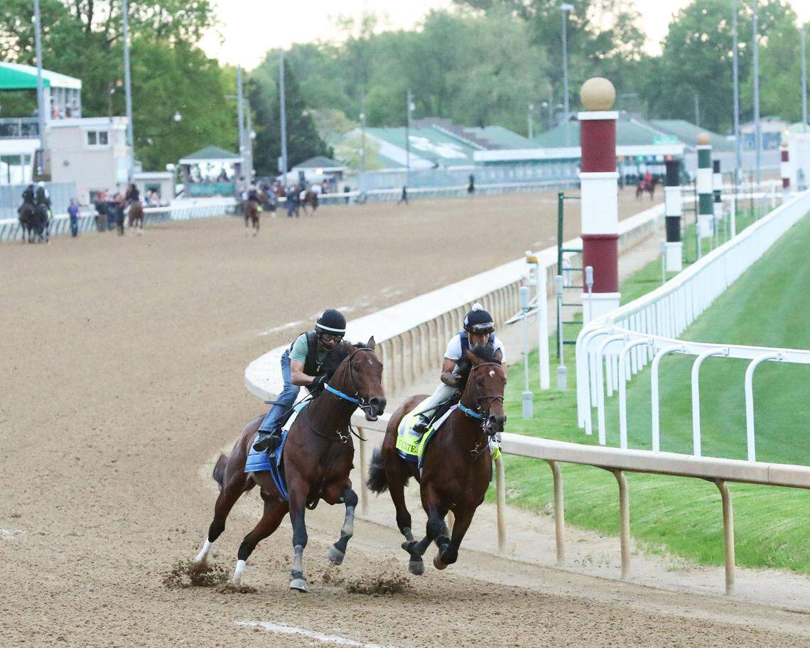 Exercise rider Wilson Fabian rides Epicenter, right, through his timed workout, running 5 furlongs beside workmate Alejandro, with Eddie Martin Jr. aboard, at Churchill Downs on May 1.