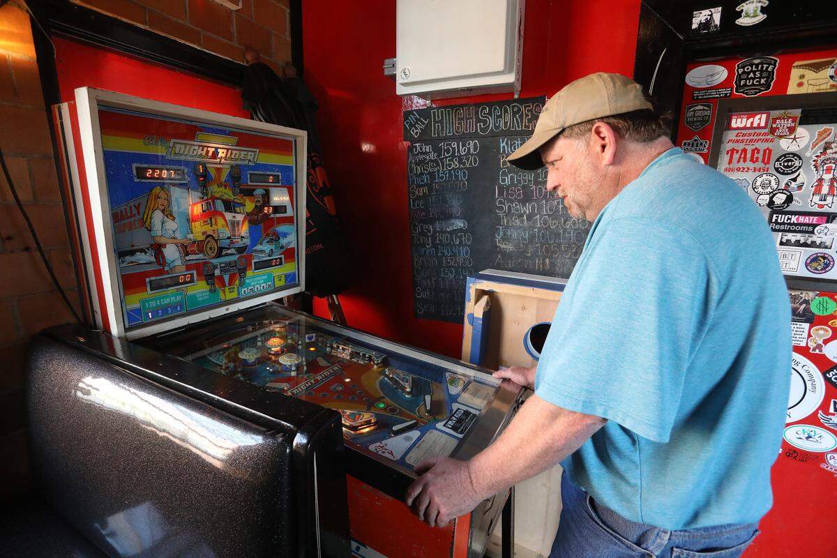 A patron played pinball Tuesday at The Break Room at the Pepper Distillery.