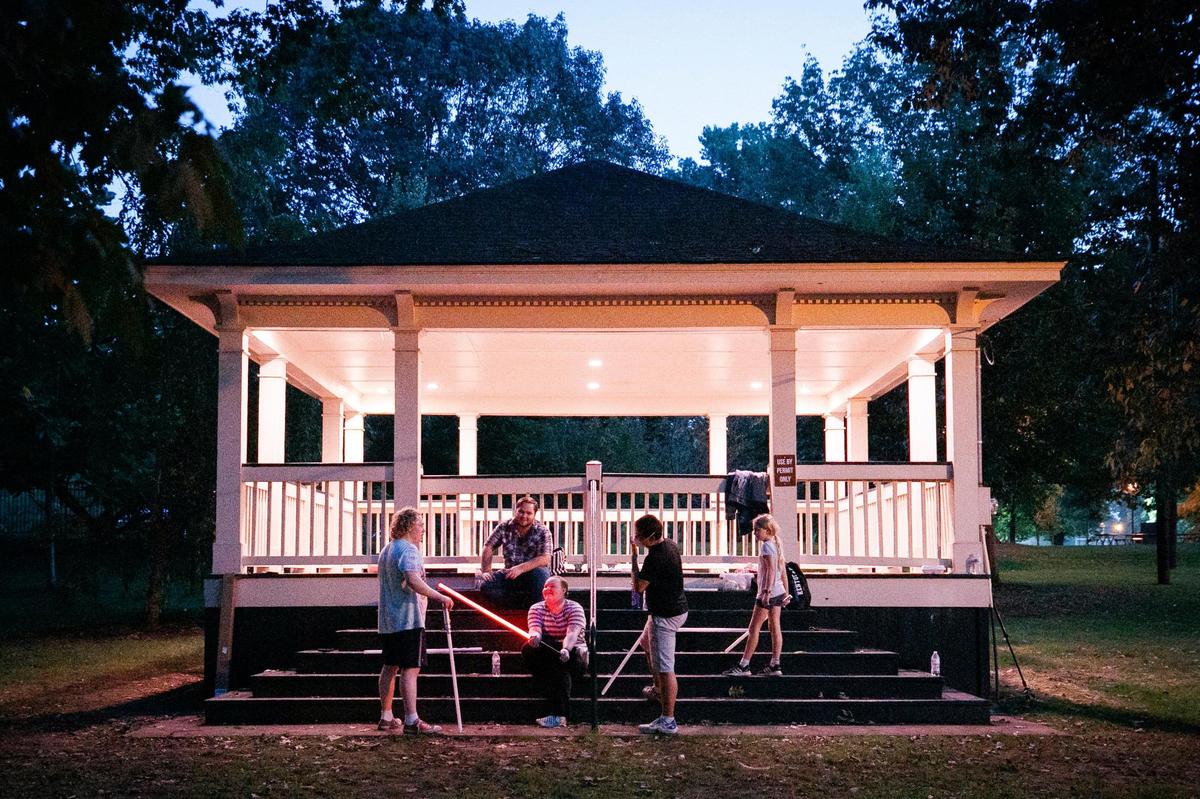 Members of the Lexington Lightsaber League gather at a shelter during a Wednesday practice at Woodland Park. There is no admission or class fees to join plus spare lightsaber’s are available.