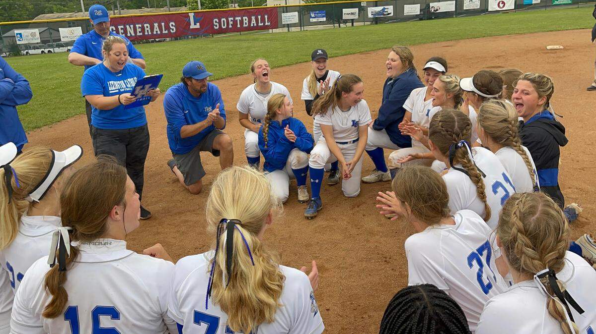 Lexington Catholic players kneel for their traditional postgame breakdown after defeating Lafayette in the 43rd District title game.