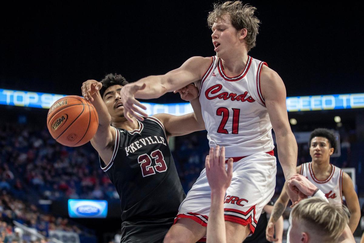 Pikeville’s Alex Rogers (23) and Clark County’s Tanner Walton (21) battle for the ball during their Sweet 16 quarterfinal matchup in Rupp Arena on Friday.