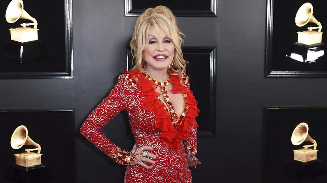 FILE - Dolly Parton arrives at the 61st annual Grammy Awards on Feb. 10, 2019, in Los Angeles.