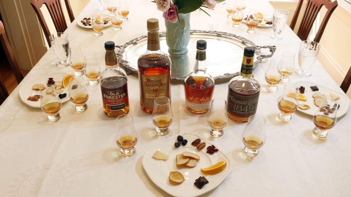 For our tasting with bourbon experts Mike Veach and Susan Reigler, we compared two traditional bourbons (Old Forester Signature and Ancient Ancient Age 10 Year) with wheated ones (W.L. Weller Special Reserve and Old Fitzgerald Bottled in Bond). Each taster was provided with water and a plate of nibbles that could neutralize or heighten the whiskies' flavors: cheese, nuts, bread, fruit and chocolate.  