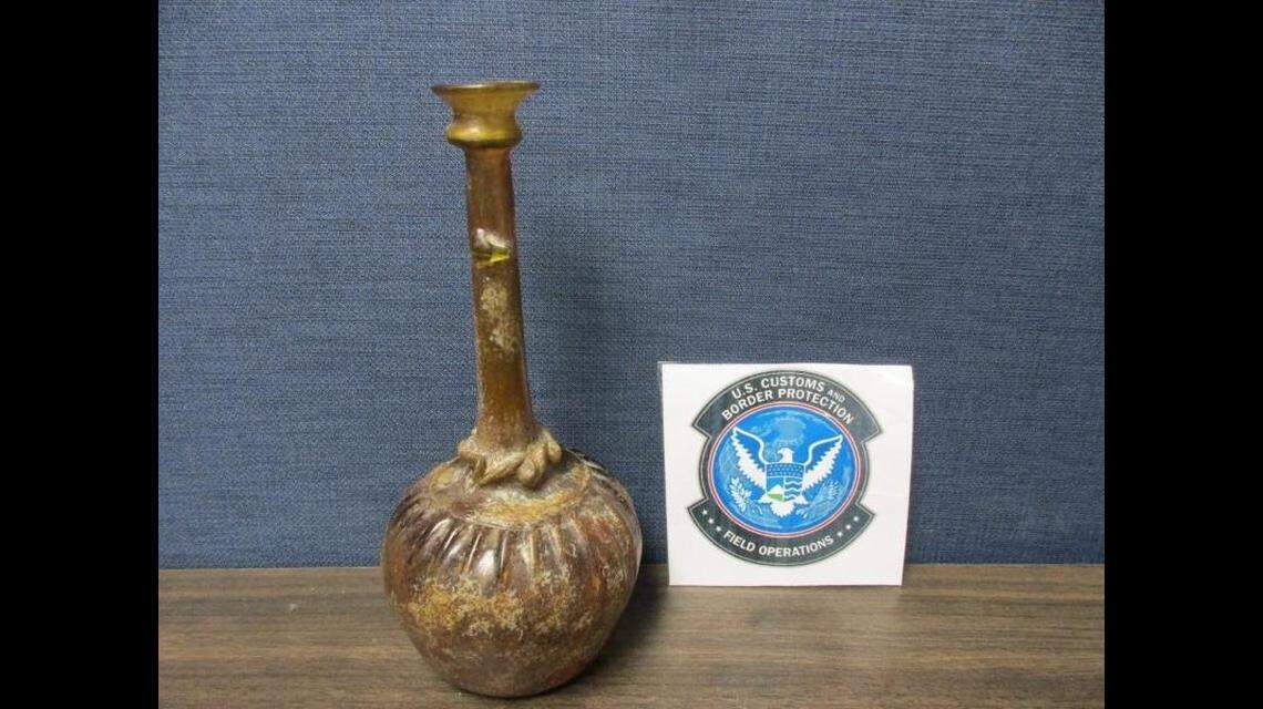 Officials seized the amber glass bottle which an expert said was made in Iran between the 11th and 13th centuries.