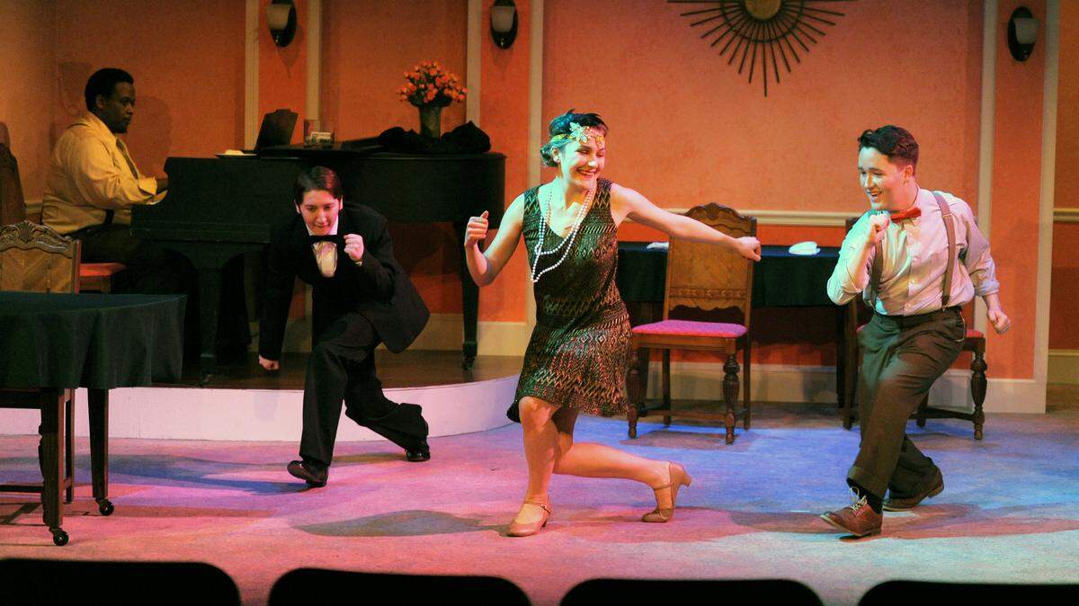 In this scene from “Nights at the Algonquin Round Table,” actors take a short dance break. Jack Beck, the ‘new kid in town,’ is dancing with Sally Ardath, a waitress at the Algonquin Hotel’s Rose Room Restaurant. Pictured are (left to right): The Piano Man (Myel Byrd), Isaac Reeder (Isaac Reeder), Sally Ardath (Abby Davis) and Jack Beck (Hayden Bennett).