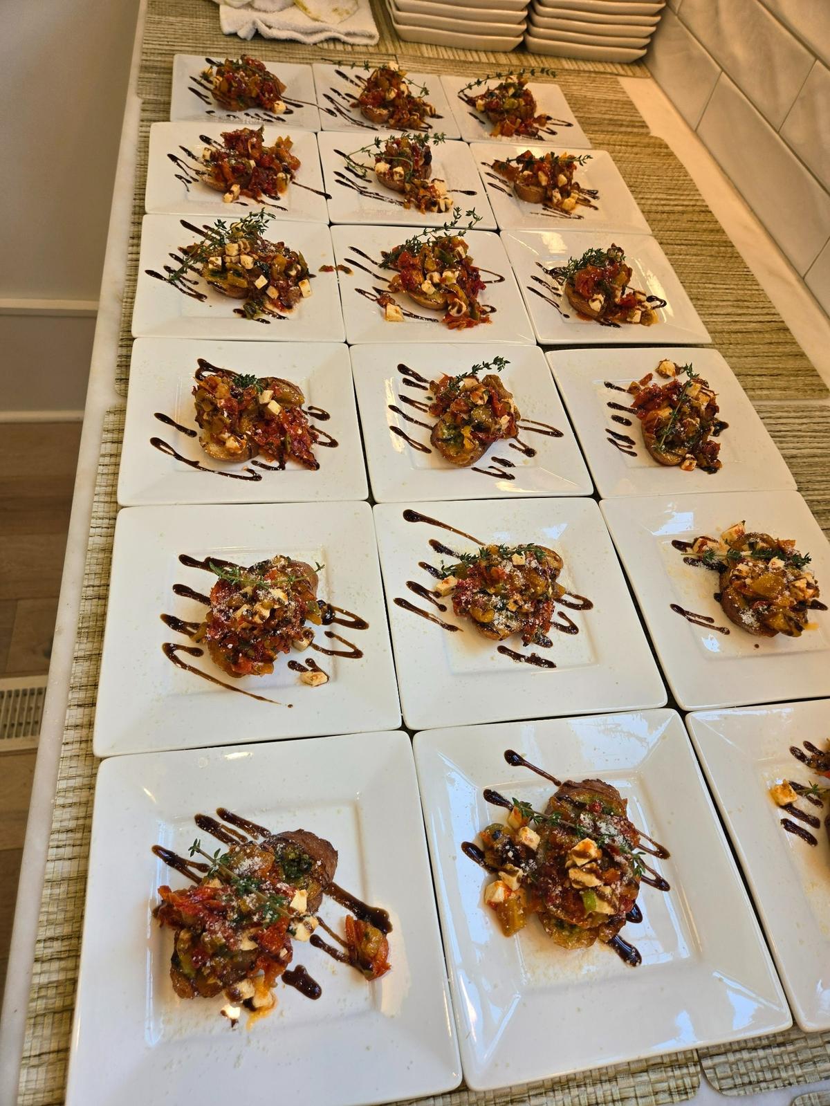 Rows of chef Rodney’s bruschetta appetizer waiting for guests of his cooking class, which does not require you to do any of the work.