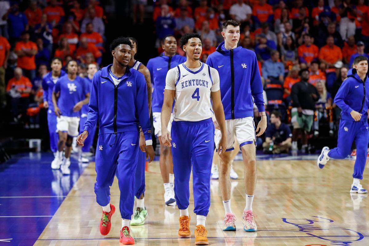 Kentucky’s Tre Mitchell led the Wildcats onto the O’Connell Center court in Gainesville last weekend before an eventual 87-85 win over Florida in the first SEC road game of the season.
