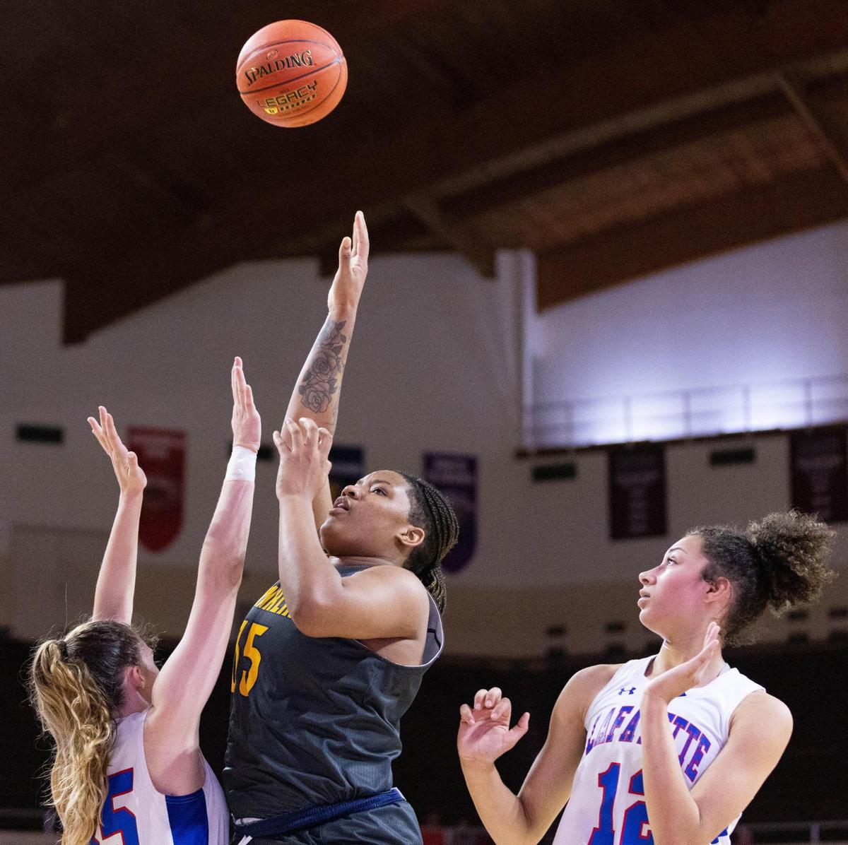 Franklin County’s Patience Laster (35) shoots the ball over the Lafayette defense during the Flyers’ 41-29 win in the girls’ 11th Region championship game.
